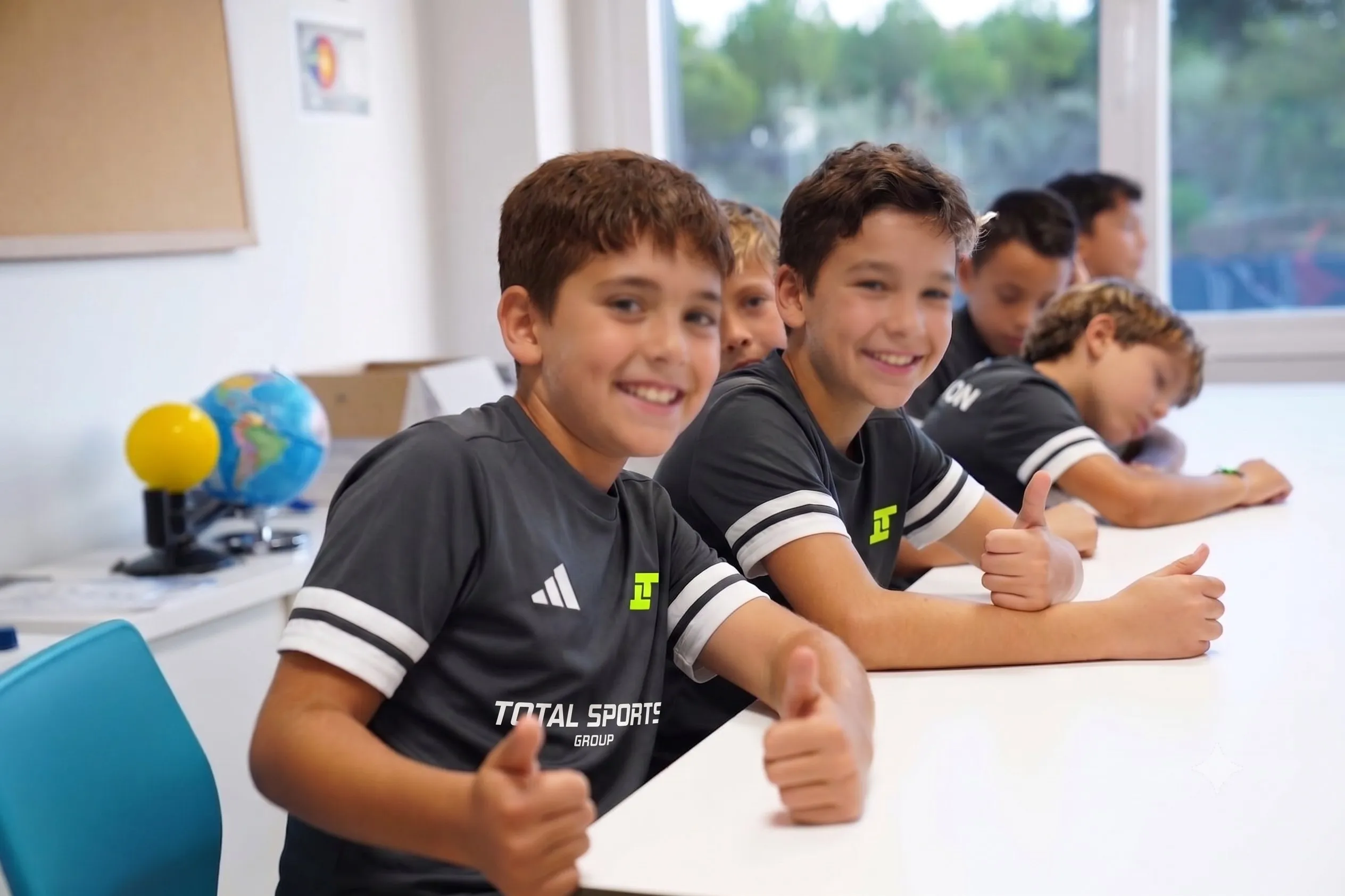 Students in Total Sports kit at their desks in class