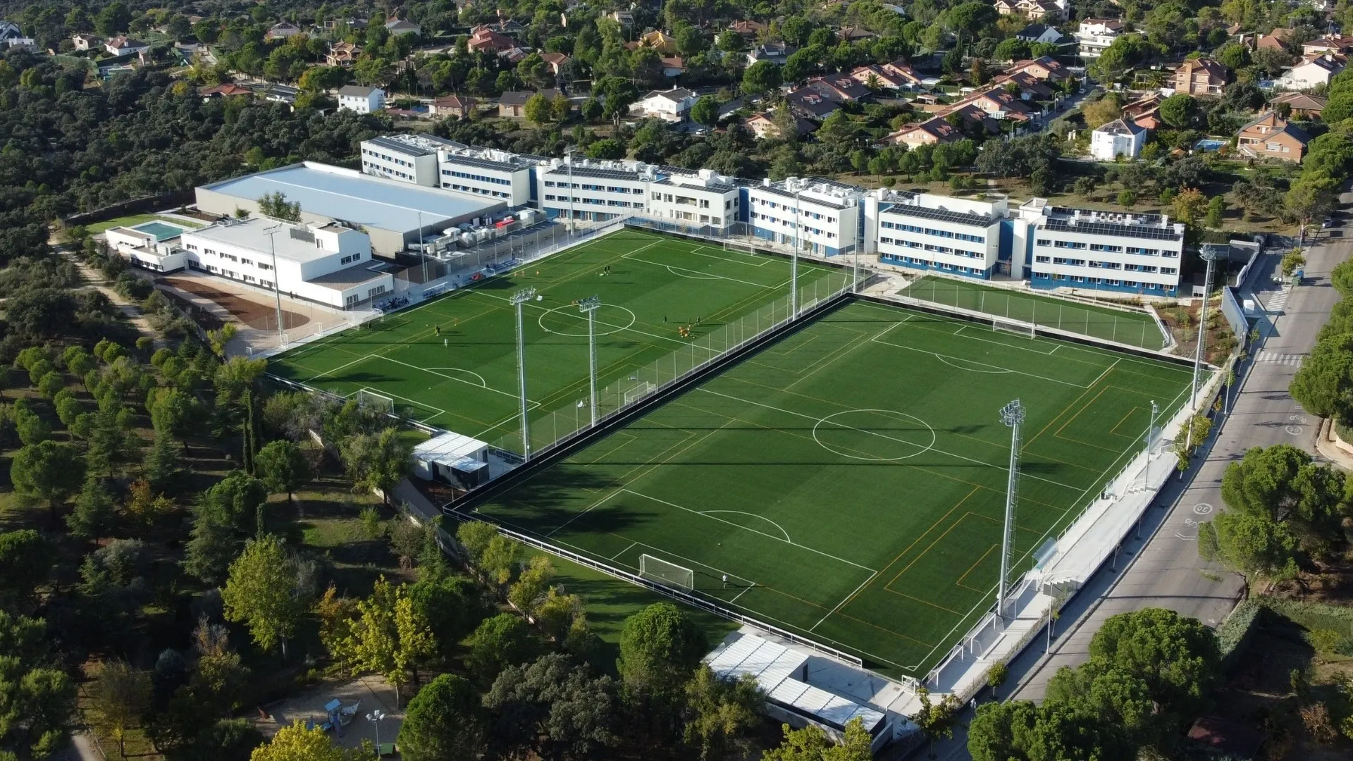 Aerial view of the campus pitches and school buildings on the edge of Madrid
