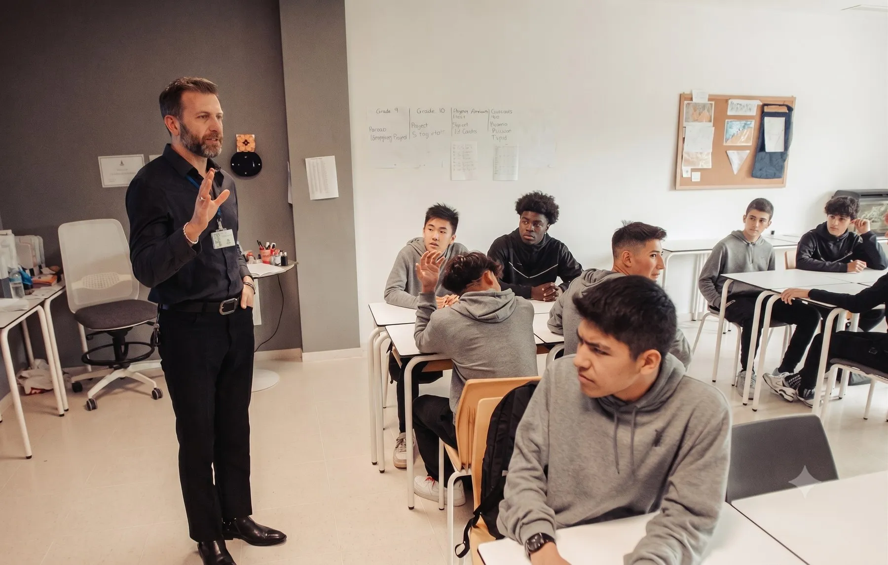 A teacher addressing students in a classroom at ESC American School