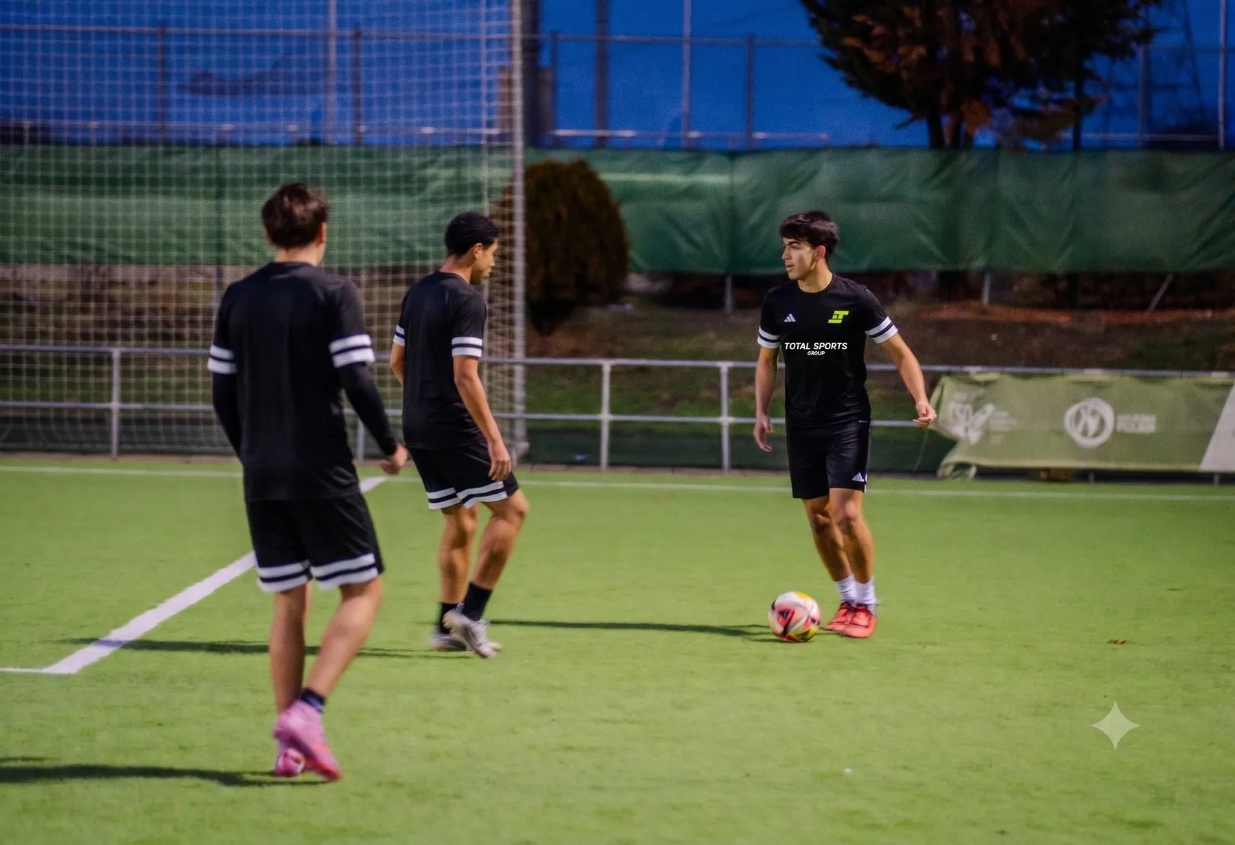 Players working with the ball during an evening training session